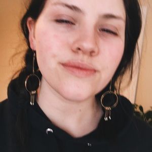 Gold color dangle earrings.